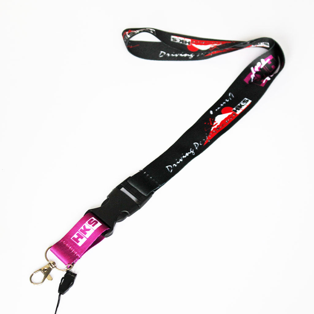 A HKS JDM lanyard is placed on a white background