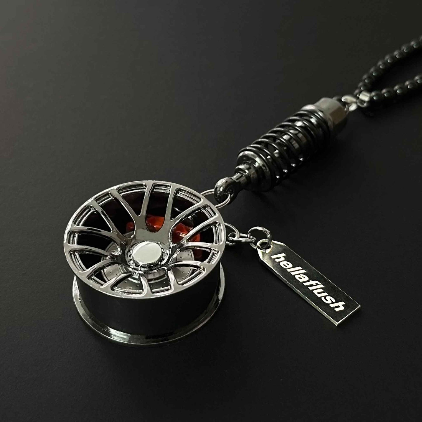 A black BBS style wheel decor flat laid on a black background