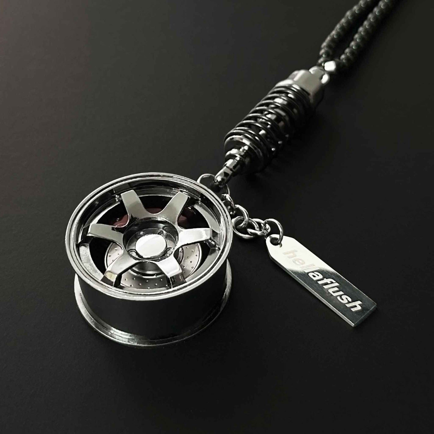 A black TE-37 style wheel decor flat laid on a black background