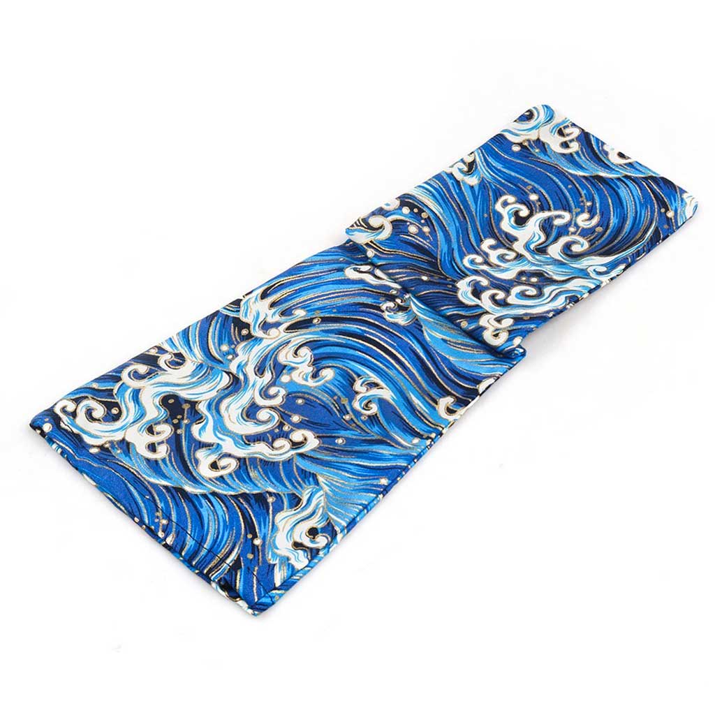 A blue waves shift stick cover flat laid being unfolded on a white background