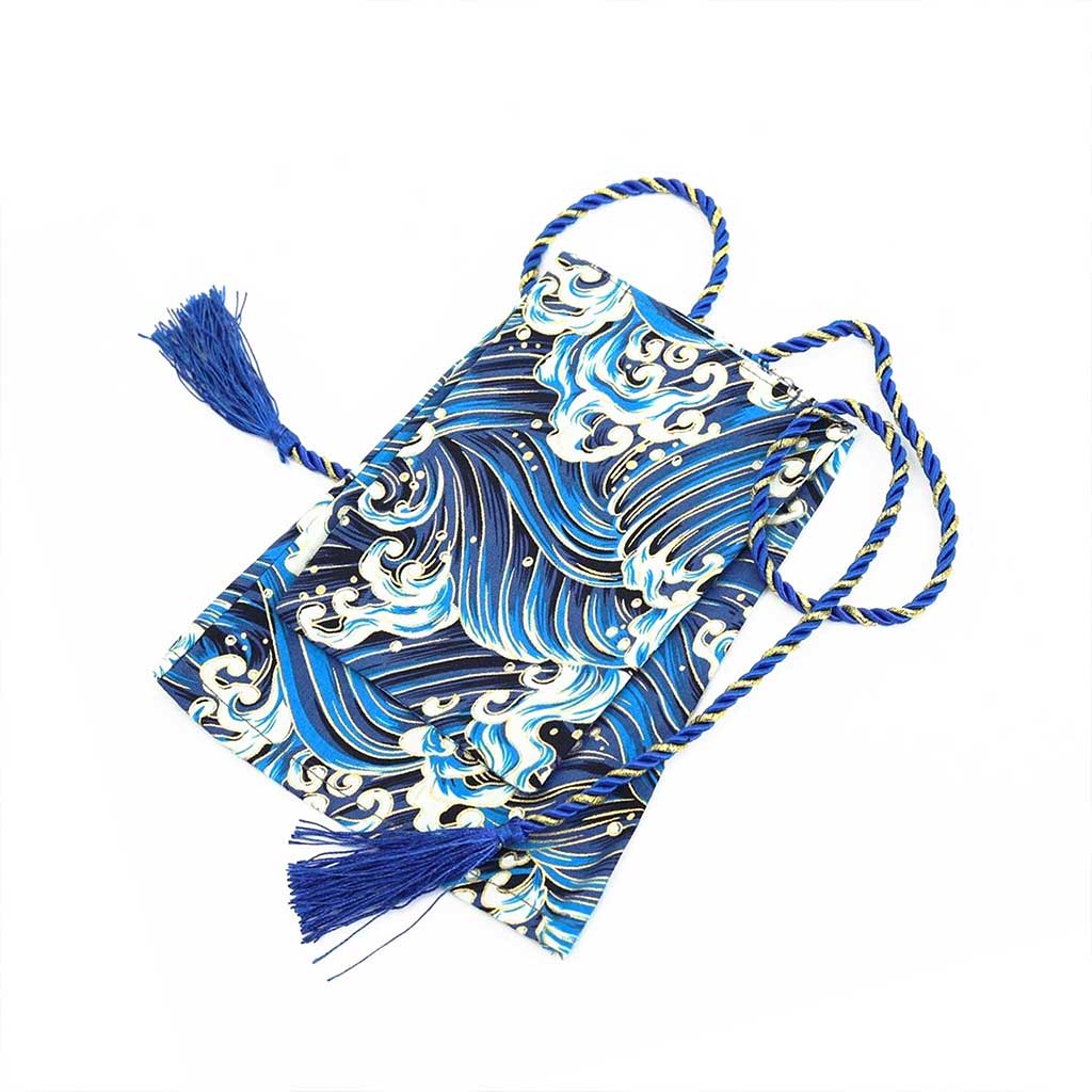 A blue waves shift stick cover flat laid on a white background