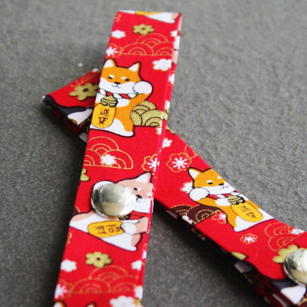 Close-up of the maneki-shiba straps