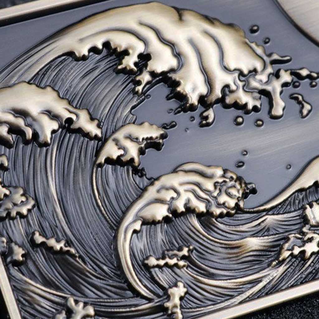 Close-up of a Japanese great waves metal badge