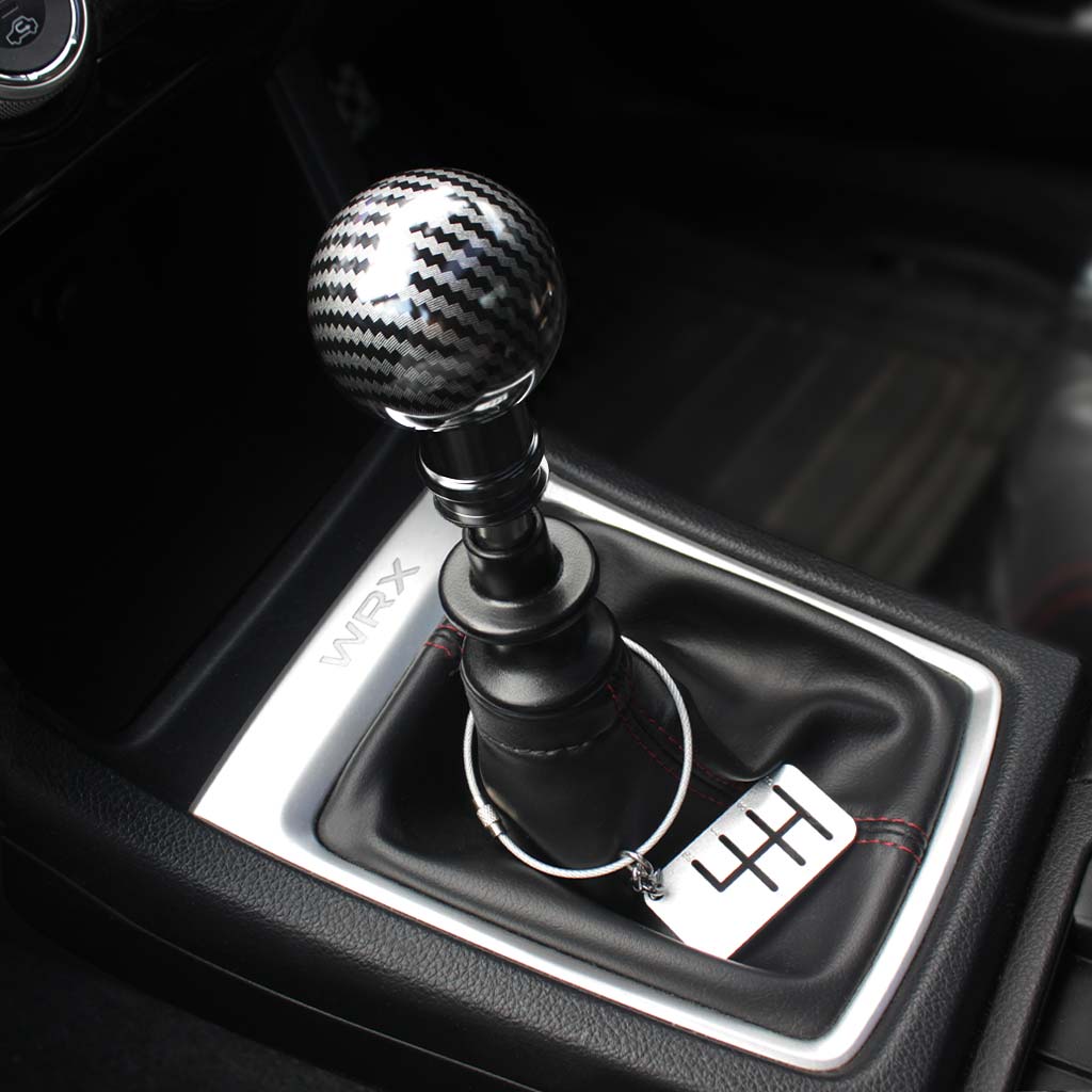 The Obsidian installed on a WRX with a six-speed dog tag hung on the shift boot