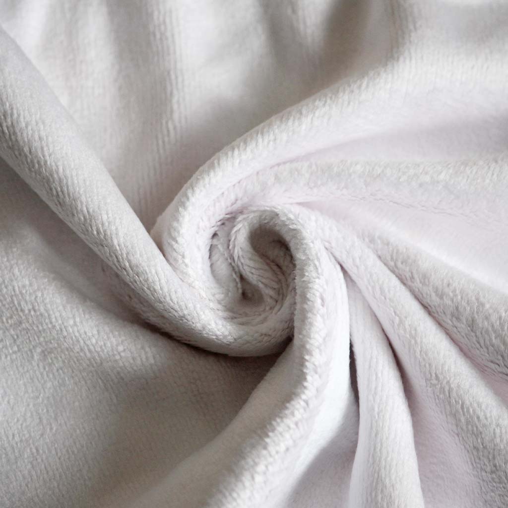 Close-up of the back of the car towel which is white, showcasing its soft material