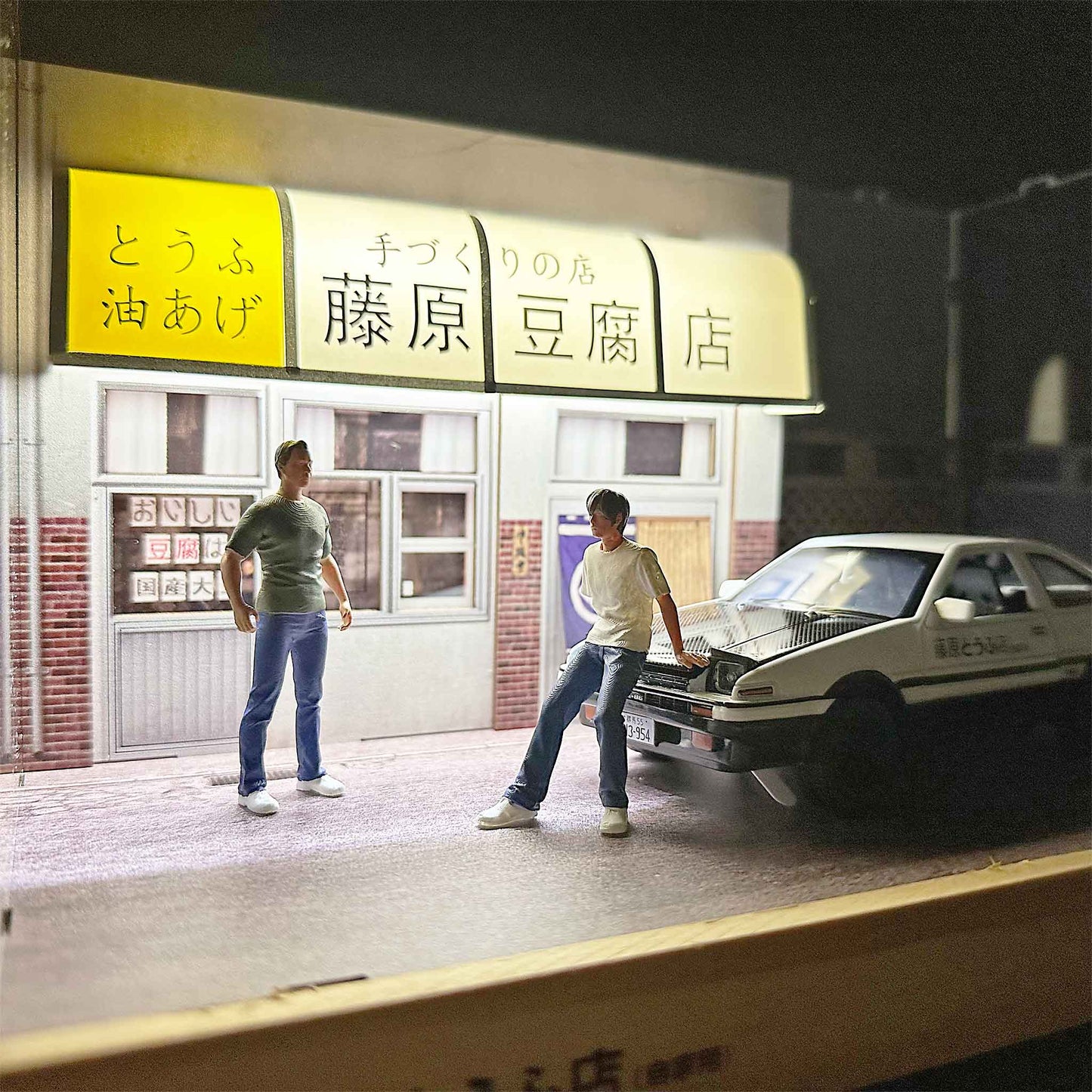 Close-up of a single-storey Initial-D Fujiwara Tofu Shop diorama with an AE86 car model and mini figures in it