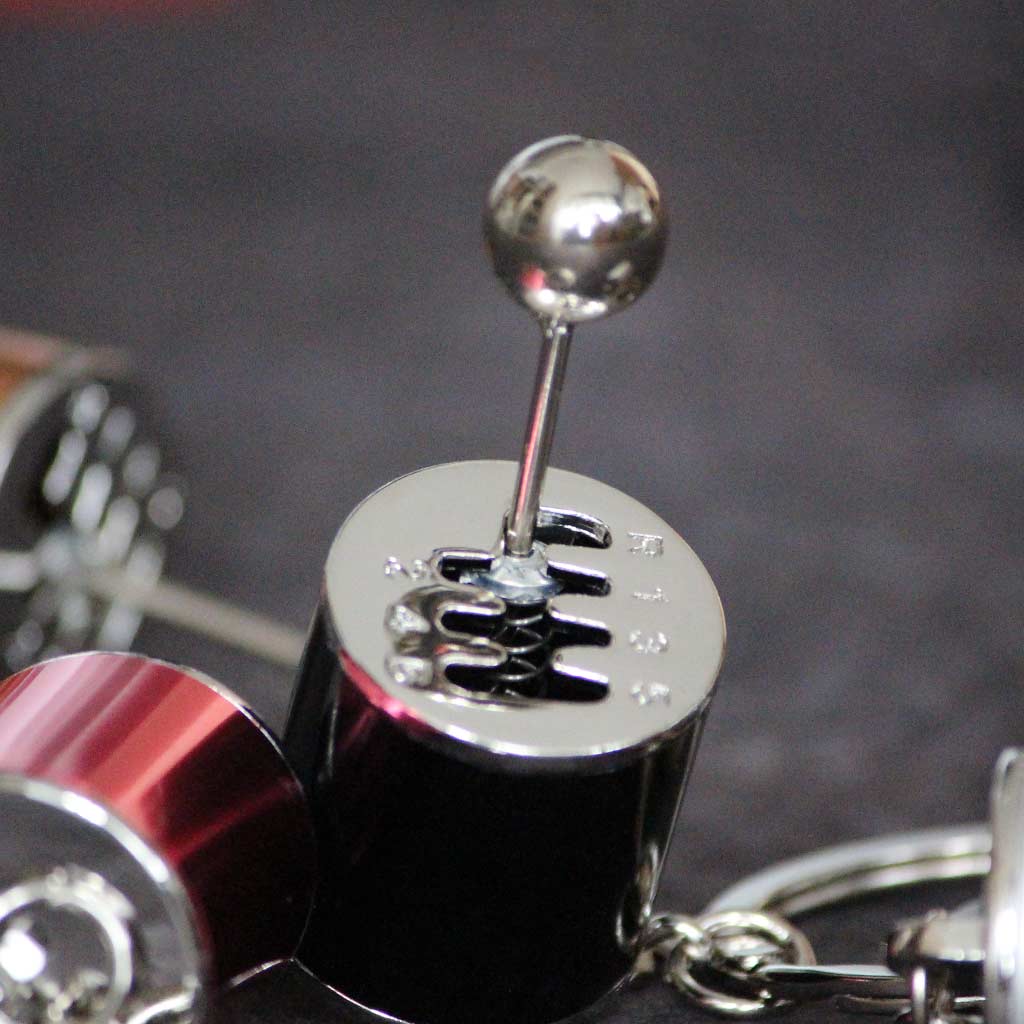 Close-up of a black turbo keychain's gear stick