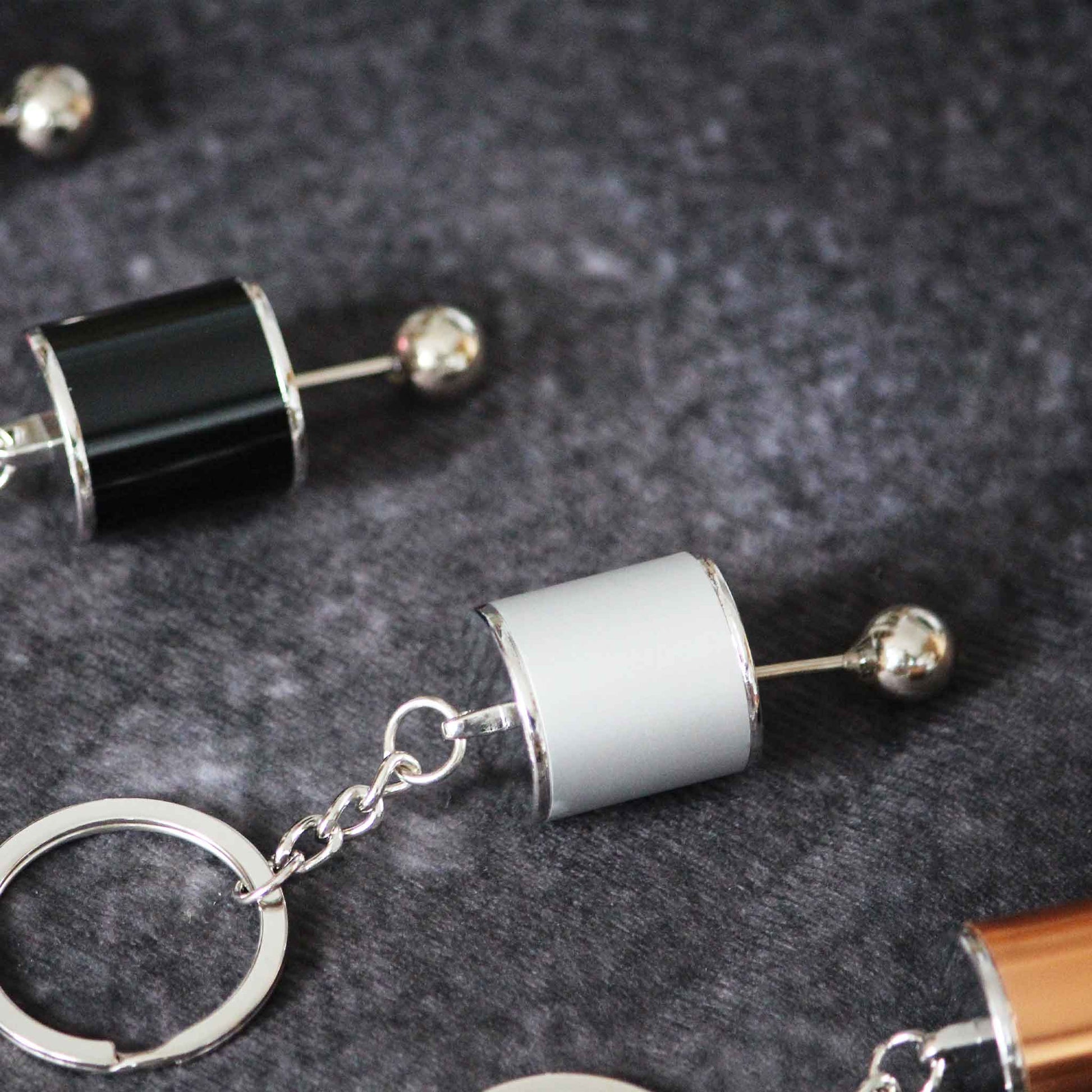 Grey turbo keychain centred with the black on side