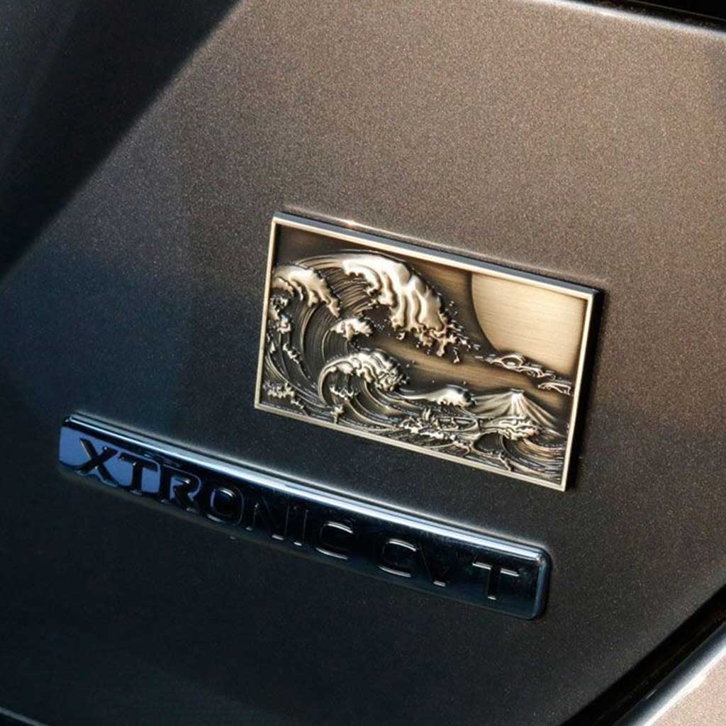 JDM metal badge in a Japanese car interior