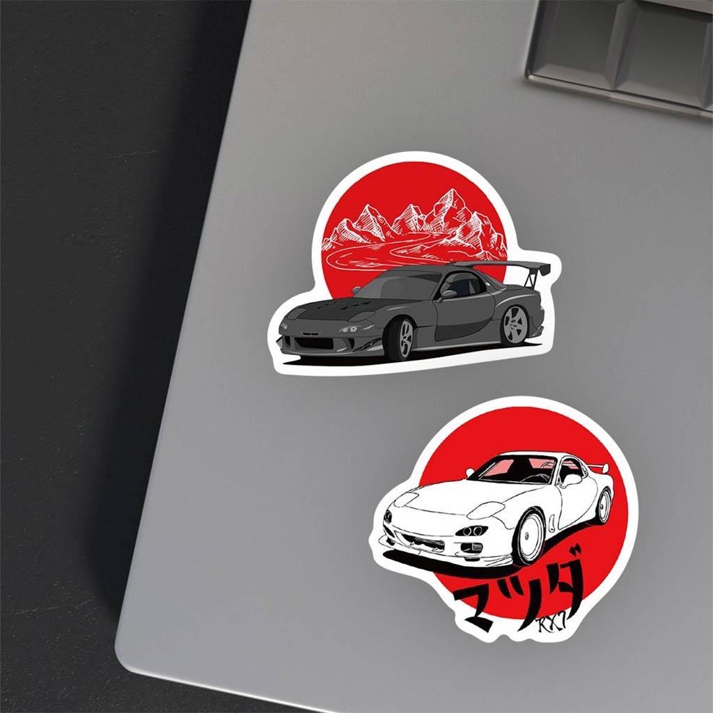 Mazda RX7 stickers applied on a grey laptop