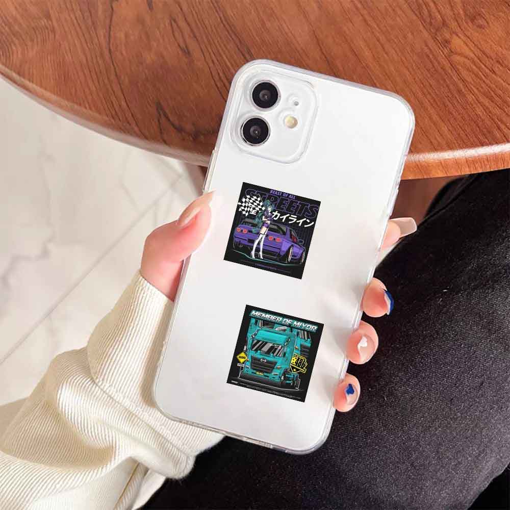 A hand holding a phone case with JDM mini stickers