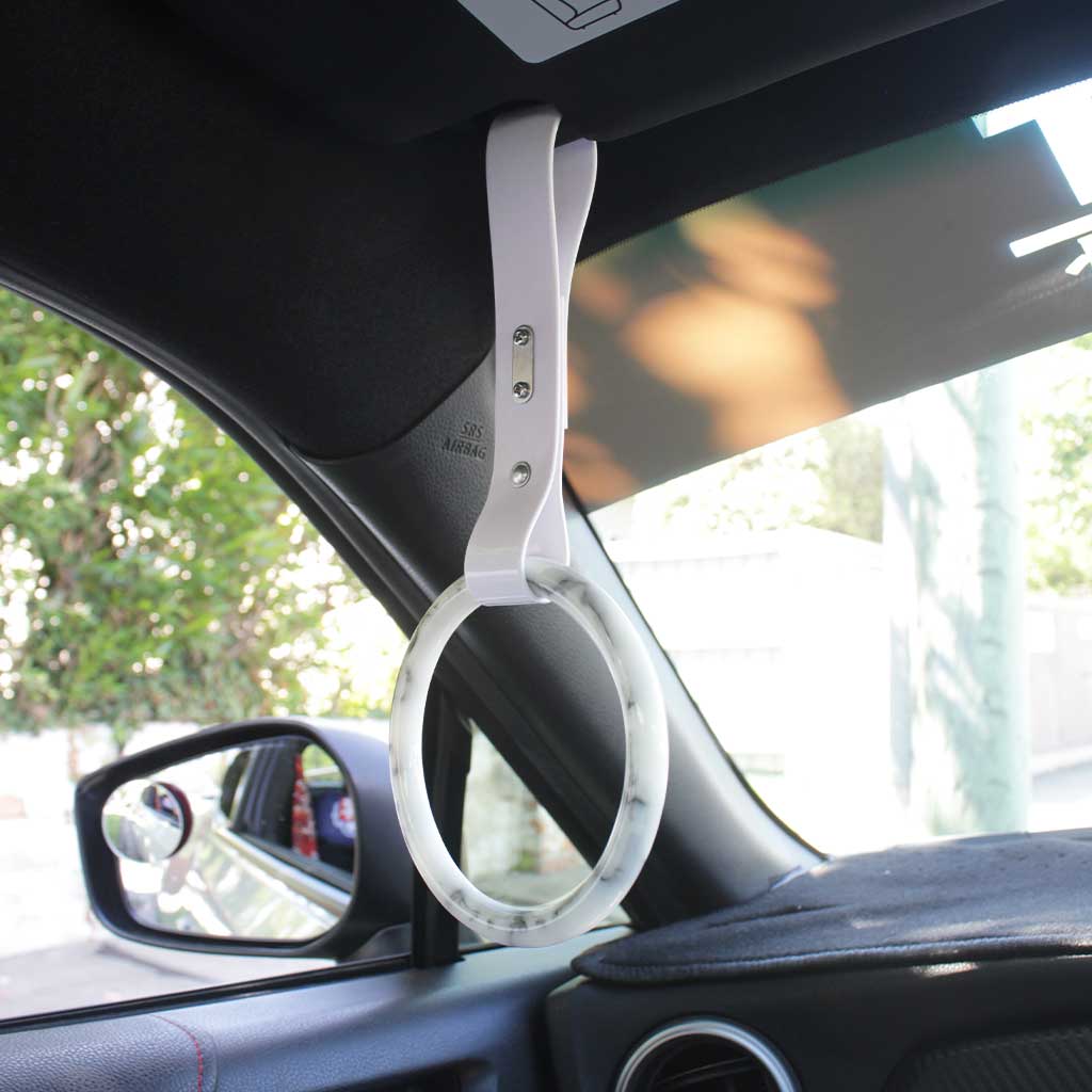 A marble tsurikawa with white strap hang in a white GT86