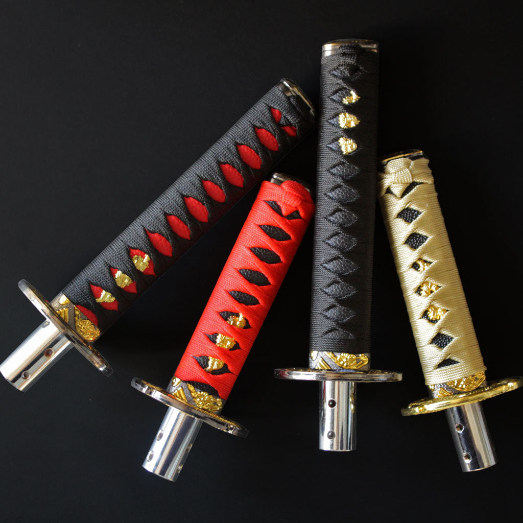 Katana shift knobs flat laid on a black blackground