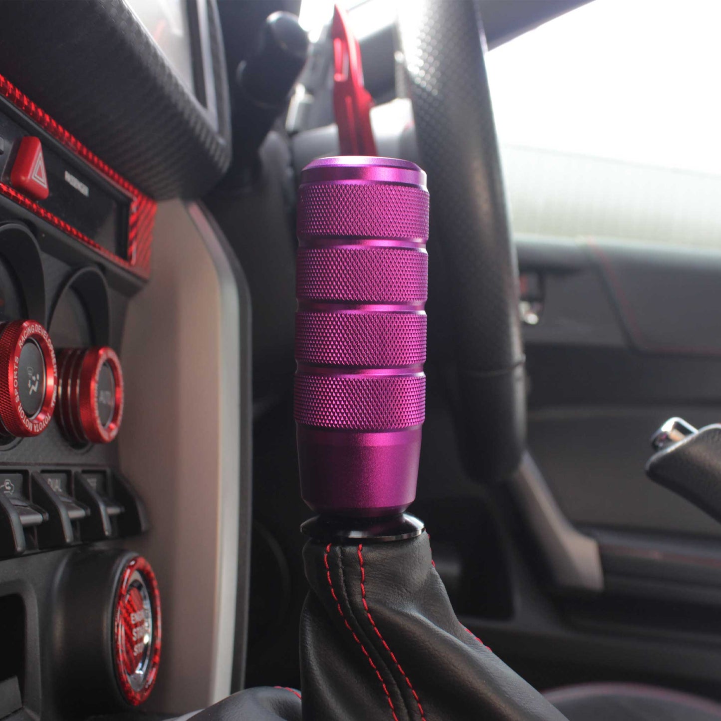 A purple shift knob installed in an automatic Toyota 86