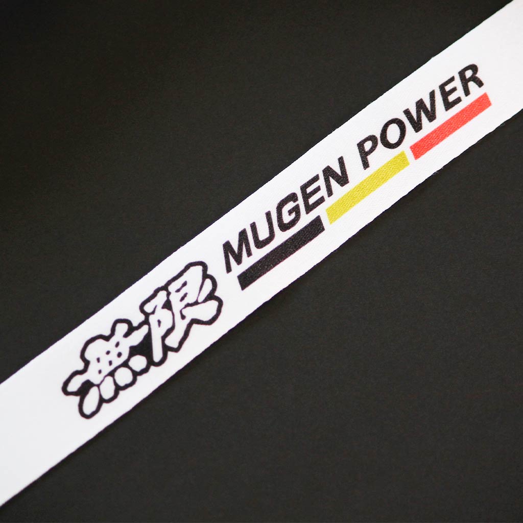 Close-up of the 'MUGEN POWER' English and Japanese writings with three lines underneath