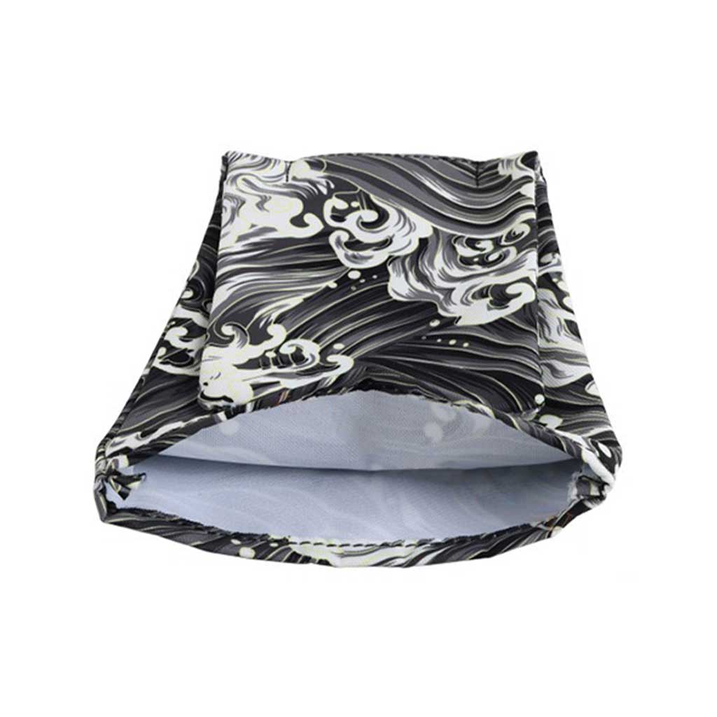 A black waves shift stick cover with being bottom part being opened flat laid on a white background
