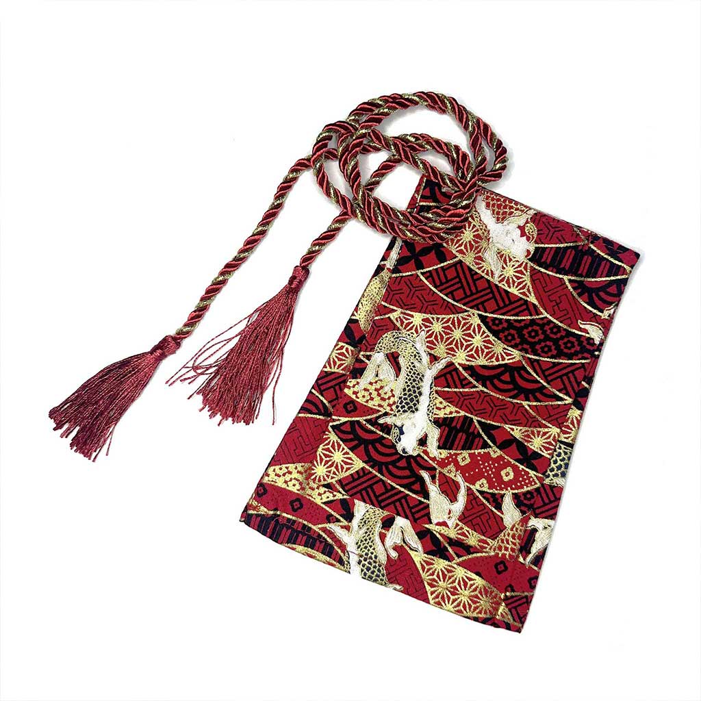 A red koi fish shift stick cover flat laid on a white background