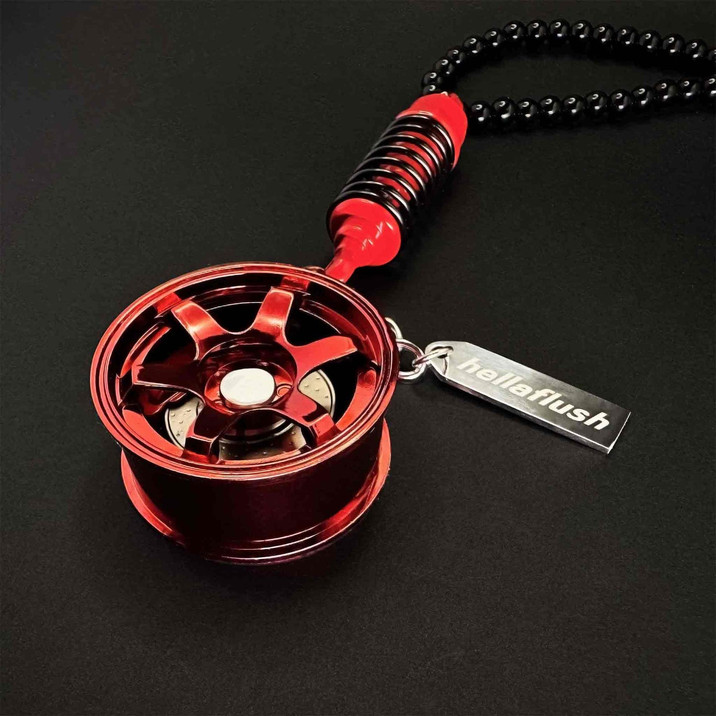 A red TE-37 style wheel decor flat laid on a black background