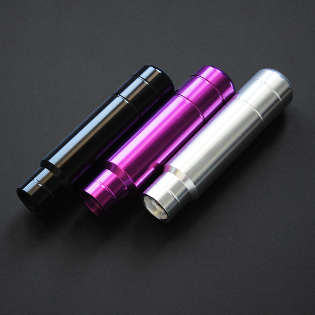 Aftermarket shift knobs in different colours aesthetically flat laid on a black background