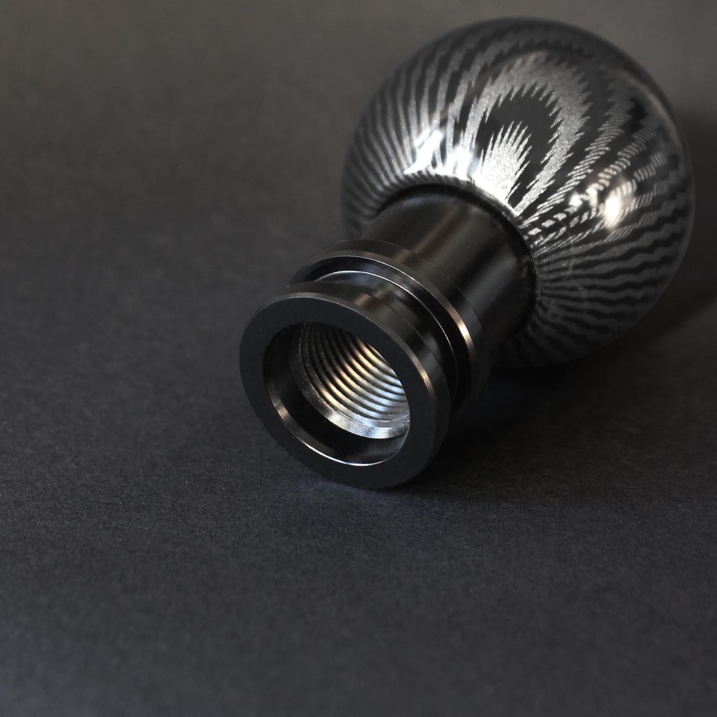 Showcasing the bottom thread of The Obsidian on a black background