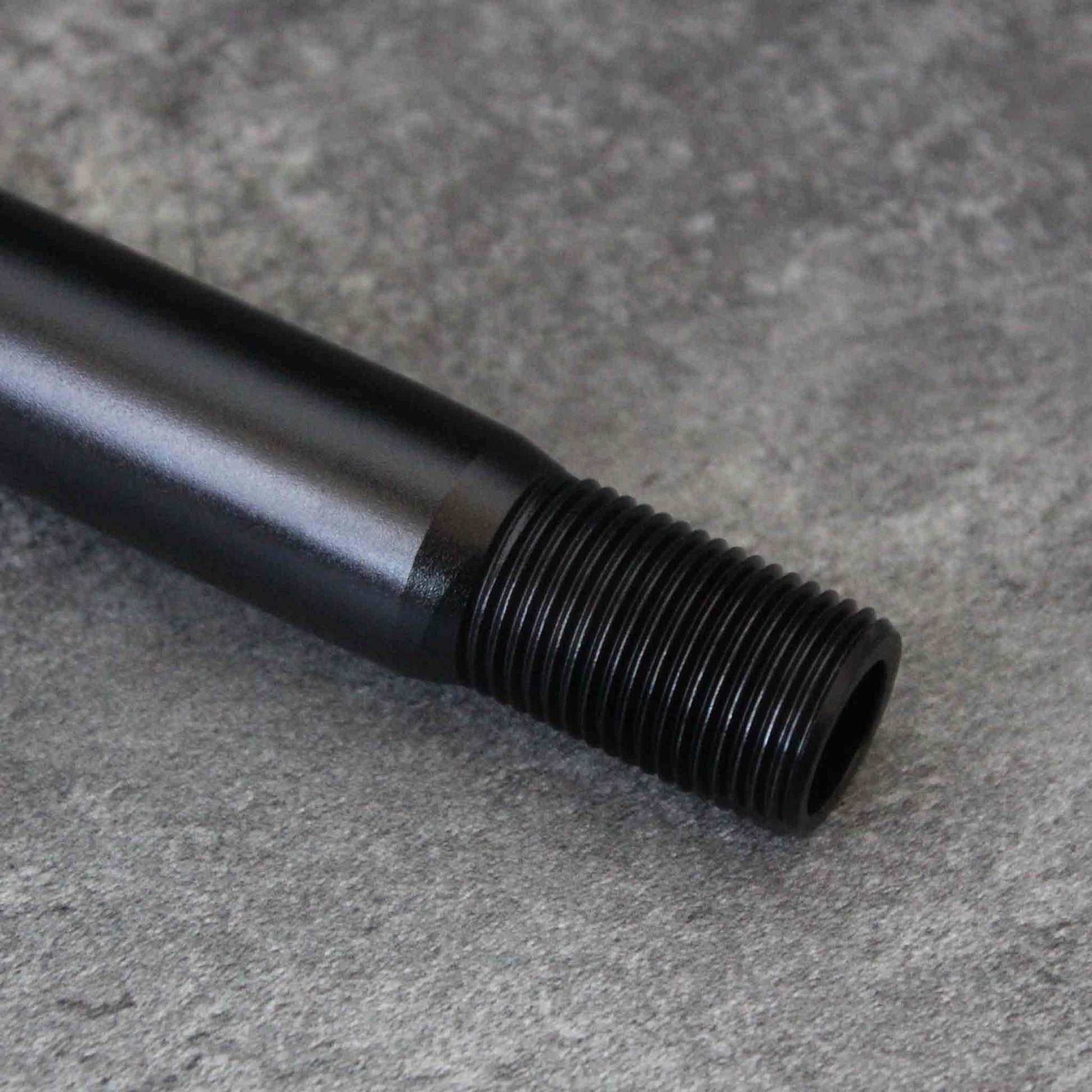 Close-up of the extension's threaded head section on a grey background