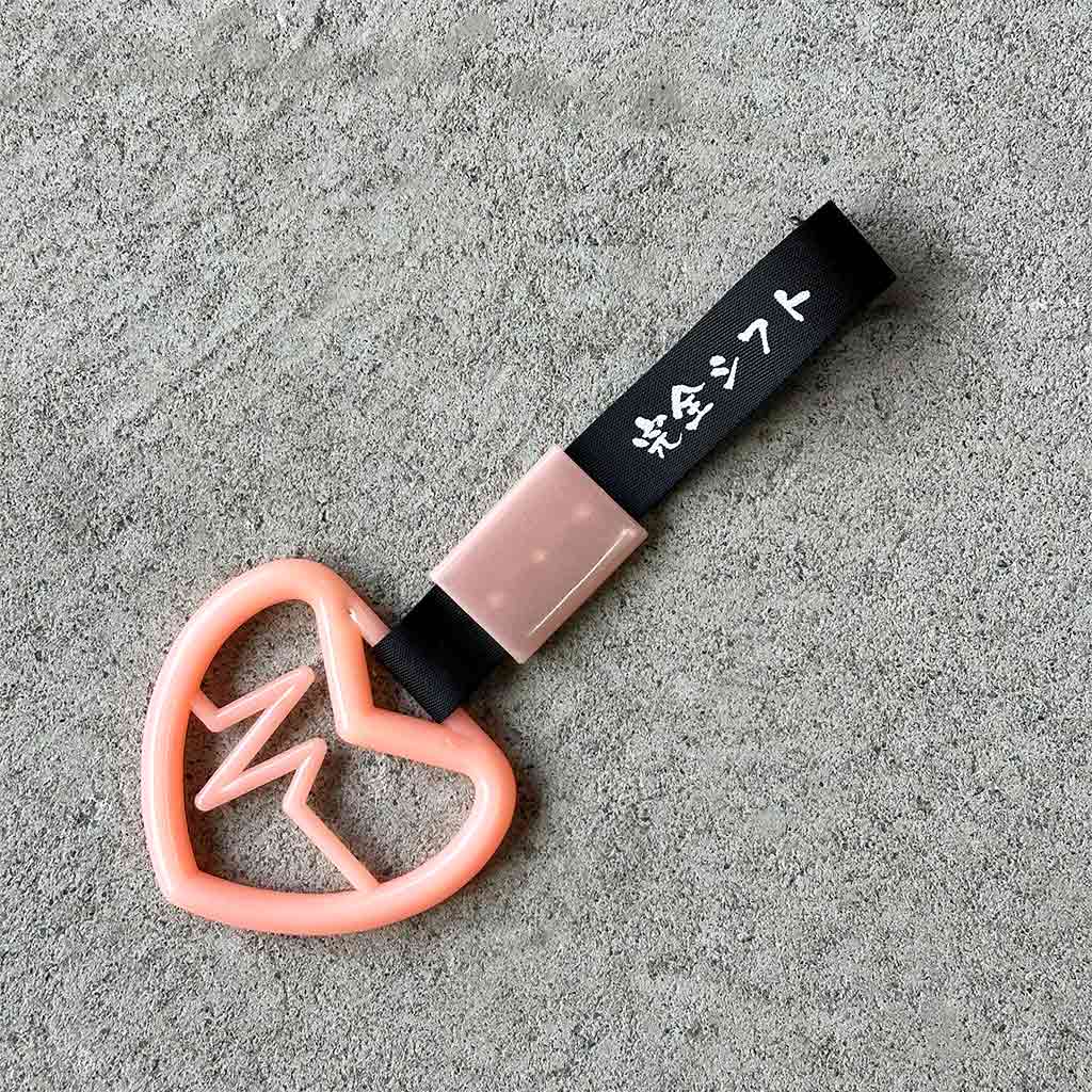 A pink tsurikawa flat laid on the concrete ground