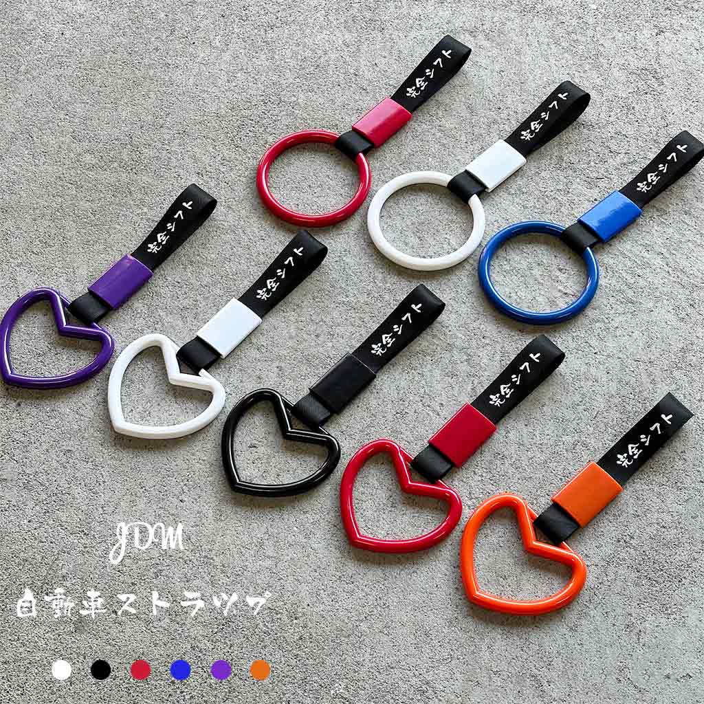 JDM handle straps also known as Tsurikawa with Perfect Shift logo on black strap in different colours placed on a concrete ground
