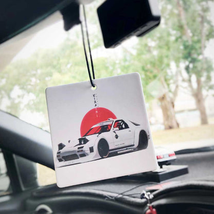 A honda nsx air freshener hung in a car