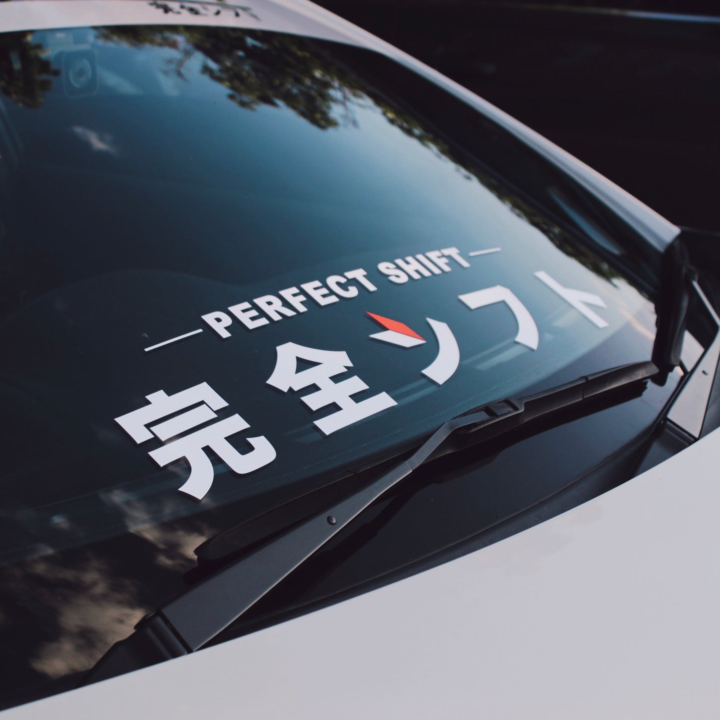 JDM car sticker 'Perfect Shift' on a white Toyota 86