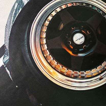 Close-up of the AE86 wall art showcasing the rims and vintage wheel