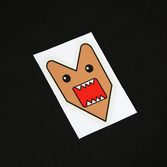 A Domo Kun sticker on a black background