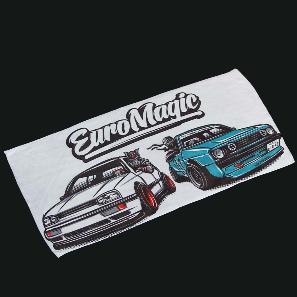 A car towel featuring two European vintage cars and the white writing 'Euro Magic' on a black background