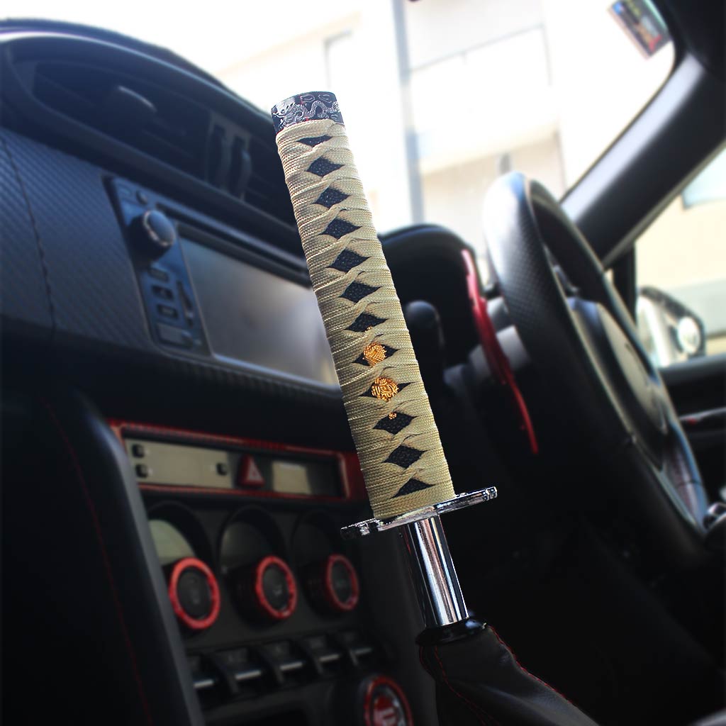 A gold katana shift knob is installed on an auto Toyota 86 seamlessly, the car interior is decorated with red accents