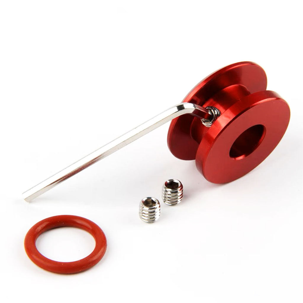 A red non-threaded boot retainer on a white background, with a mini screw inside a hole on the boot retainer, and a hex wrench screwing it. Two screws and a rubber ring are next to them