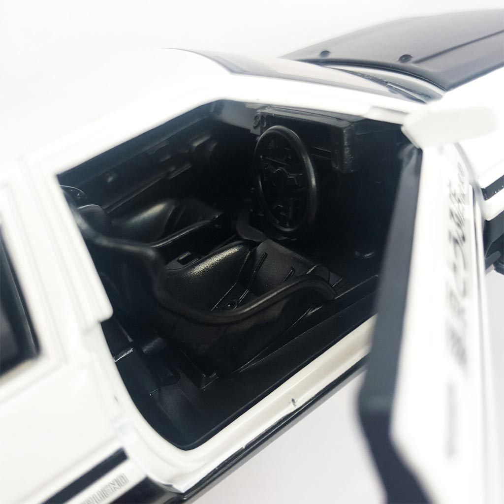 Close-up of an AE86 car model's opened side door