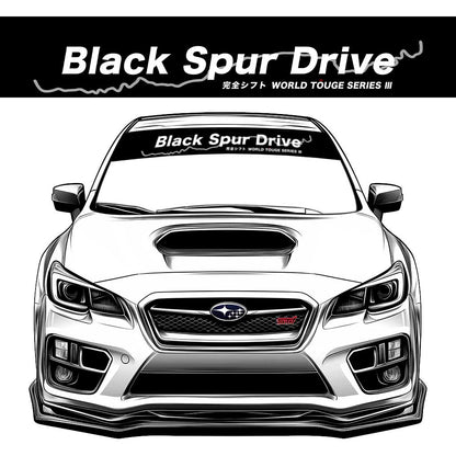 A black JDM car banner sticker with white character 'black spur drive' on a Subaru WRX STI front window