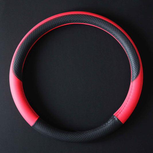 A black and red leather steering wheel cover in O shape flat laid on a black background