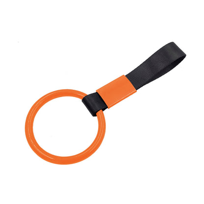 A orange ring tsurikawa with black handle strap flat laid on a white background