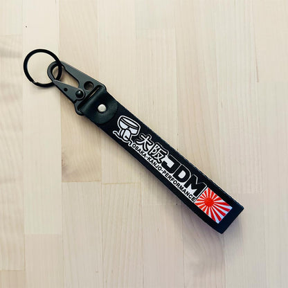 A flat lay Osaka lanyard on a wooden table