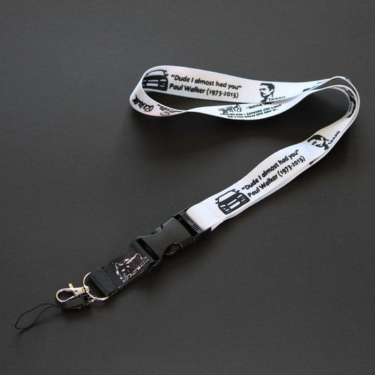 A long lanyard themed Paul Walker placed on a black background