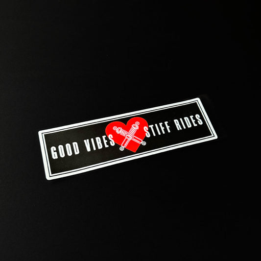 A good vibes JDM slap sticker flat laid on a black background