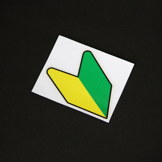 A JDM wakaba leaf sticker on a black background